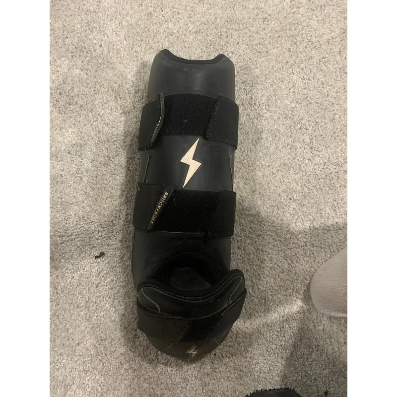 Black Bruce bolt leg guard