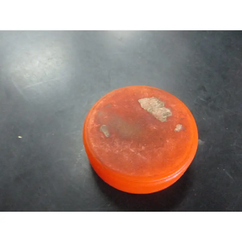 Used Orange Street Hockey Puck